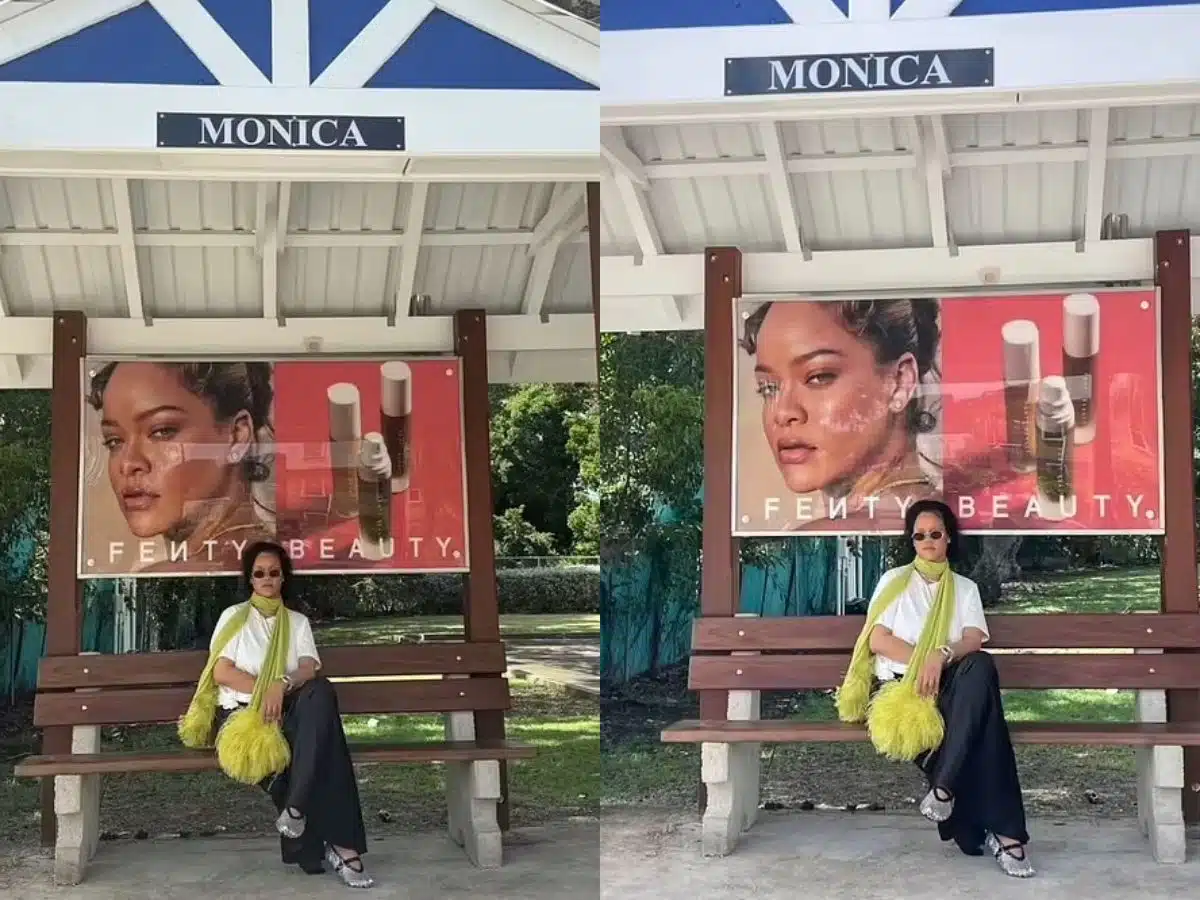 Rihanna keeps it cool in bus stop post with Fenty Beauty ad in background