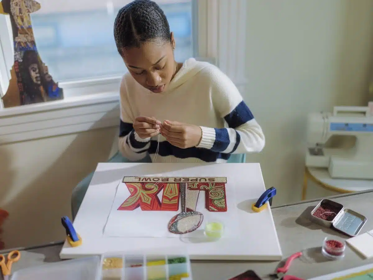 Get to know Queen Tahj Williams, the first artist to handcraft Super Bowl logo and theme art for NFL